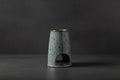 Gray ceramic oil burner on a white background