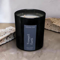 Tranquil Earth luxury soy wax candle in a black gloss jar with a dark navy label by Nóisin Íon.