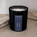 Golden Grove luxury soy wax candle in a black gloss jar with warm citrus and woodland-inspired fragrance by Nóisin Íon.