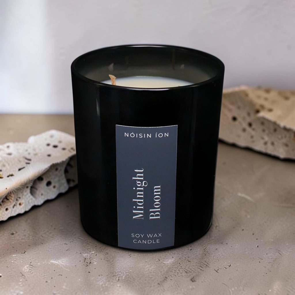 Midnight Bloom luxury soy wax candle in a black gloss jar with elegant floral fragrance by Nóisin Íon.