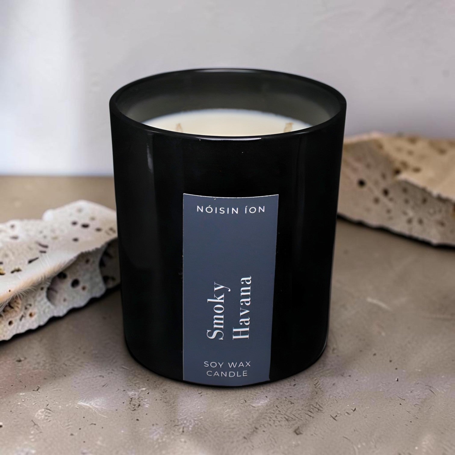Smoky Havana luxury soy wax candle in a black gloss jar with rich tobacco, spice and woody fragrance by Nóisin Íon.